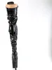A single black, shiny thigh-high boot with buckles and a high heel, shown against a white background. The top of the boot is open, revealing a tan-colored lining. Produktbild-Vorschau
