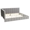 A grey upholstered bed frame with a slatted mattress support. Podgląd zdjęcia produktu
