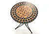 A round mosaic table with a black metal base, shown against a white background. Podgląd zdjęcia produktu