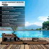 A wooden rowing machine is placed on a wooden deck in front of a swimming pool with mountains in the background. Produktbild-Vorschau