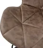 A close-up view of the quilted seat of a bar stool. Produktbild-Vorschau