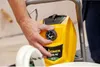 A person's hand is adjusting a dial on a yellow paint sprayer. Náhled obrázku produktu