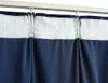 Close-up of navy blue curtains hanging from a white curtain track. Produktbild-Vorschau