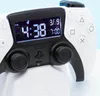 A close-up shot of a white and black PlayStation PS5 controller with a digital display showing the time and date. Náhled obrázku produktu