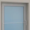 A close-up view of a white window frame with a blue glass pane and a white adjustable rod attached. Produktbild-Vorschau