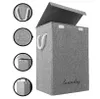 A grey laundry basket with a lid and rope handles is shown from the front. Podgląd zdjęcia produktu