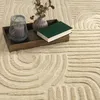 A tray with decorative items sits on a textured rug. Anteprima dell’immagine prodotto