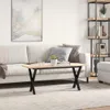 A living room scene with a couch, coffee table, and bookshelf. Produktbild-Vorschau