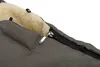A close-up view of a gray stroller footmuff with a zipper partially open, revealing a cream-colored fuzzy interior. Anteprima dell’immagine prodotto