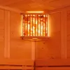 A corner of a wooden sauna with a lit salt crystal lamp. Produktbild-Vorschau