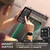 A person using a smartphone and smartwatch while standing next to a treadmill. Produktbild-Vorschau