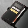 A close-up view of a black leather wallet case with red stitching, showing credit cards and banknotes inside. Anteprima dell’immagine prodotto