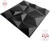 A black, geometric 3D wall panel is shown from a diagonal angle against a white background. Produktbild-Vorschau