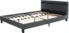A dark gray bed frame with a slatted wooden base, shown from a diagonal angle against a white background. Náhled obrázku produktu