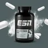 A black bottle of ESN Athlete Stack: MEN supplements is shown with white capsules scattered around it, against a gray background with white powder effects. Produktbild-Vorschau