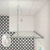 A modern bathroom shower enclosure with a glass wall and a white shower tray. Produktbild-Vorschau