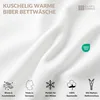A close-up of white fabric with marketing icons and text. Produktbild-Vorschau
