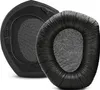 Two black ear pads for headphones are shown against a white background. One ear pad is shown from the back, revealing its plastic mounting base. The other ear pad is shown from the front, with its cushioned, faux-leather exterior and fabric interior. Produktbild-Vorschau