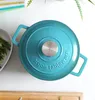 A top-down view of a teal cast iron Dutch oven on a white surface. Produktbild-Vorschau