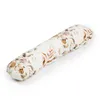A long, cylindrical pillow with a floral pattern. Podgląd zdjęcia produktu