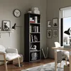 A home office or living room scene with a bookshelf, chair, and desk. Anteprima dell’immagine prodotto