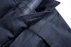 Close-up of dark blue fabric with stitching and a velcro fastener. Náhled obrázku produktu