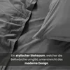 Close-up of dark grey bedding, showing texture and stitching. Náhled obrázku produktu