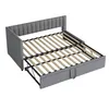 A gray upholstered sofa bed with its mattress frame extended. Anteprima dell’immagine prodotto