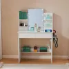 A white vanity table with a mirror and various makeup products and accessories. Produktbild-Vorschau