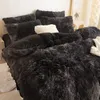 A close-up view of a bed with plush bedding and pillows. Anteprima dell’immagine prodotto