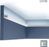 A corner of a room showing a white U-profile molding installed along the ceiling-wall junction, designed for indirect lighting. Náhľad obrázku produktu