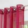 Close-up of several red sheer curtains hanging from a metal rod. Produktbild-Vorschau