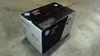 A black and white HP LaserJet toner cartridge box sits on a concrete floor. Náhľad obrázku produktu