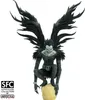 A collectible figure of Ryuk from Death Note, crouching on a skull. Voir les images du produit