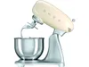 A cream and silver SMEG stand mixer with its mixing attachment lowered into the bowl. Anteprima dell’immagine prodotto