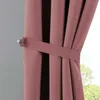 A close-up of a pink curtain held back by a tie-back. Produktbild-Vorschau
