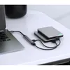 A laptop connected to a USB hub, which is then connected to two external hard drives. Produktbild-Vorschau