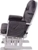 A side view of a gray upholstered rocking chair with a white wooden frame. Anteprima dell’immagine prodotto