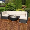 An outdoor lounge set on a wooden deck with lush greenery in the background. Anteprima dell’immagine prodotto