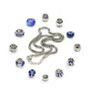 A collection of jewelry beads and a necklace arranged on a white background. Produktbild-Vorschau