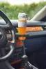 A smoothie bottle is placed in a car's cup holder. Náhľad obrázku produktu