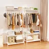 Two white garment racks with clothes hanging on them, and shelves with storage items below. Anteprima dell’immagine prodotto