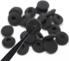 A pile of black foam earphone covers is shown against a white background, with a pair of tweezers holding one of the covers. Anteprima dell’immagine prodotto