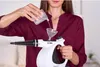 A person is filling a steam cleaner with water. Podgląd zdjęcia produktu