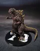 A Godzilla action figure posed on a black circular display stand. Náhled obrázku produktu