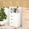 A white storage cabinet with drawers and a door, placed in a room with a large potted plant and wooden wall paneling. Náhled obrázku produktu