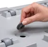 A hand is shown inserting a rubber stopper into a hole on the lid of a plastic storage box. Produktbild-Vorschau