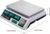 A digital scale with a stainless steel platform and a control panel with displays and a keypad. Voir les images du produit