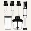 A collection of kitchen blender attachments and the blender base are arranged on a light gray background. Produktbild-Vorschau
