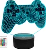 A 3D illusion lamp shaped like a game controller, with a remote control and a black base. Náhled obrázku produktu